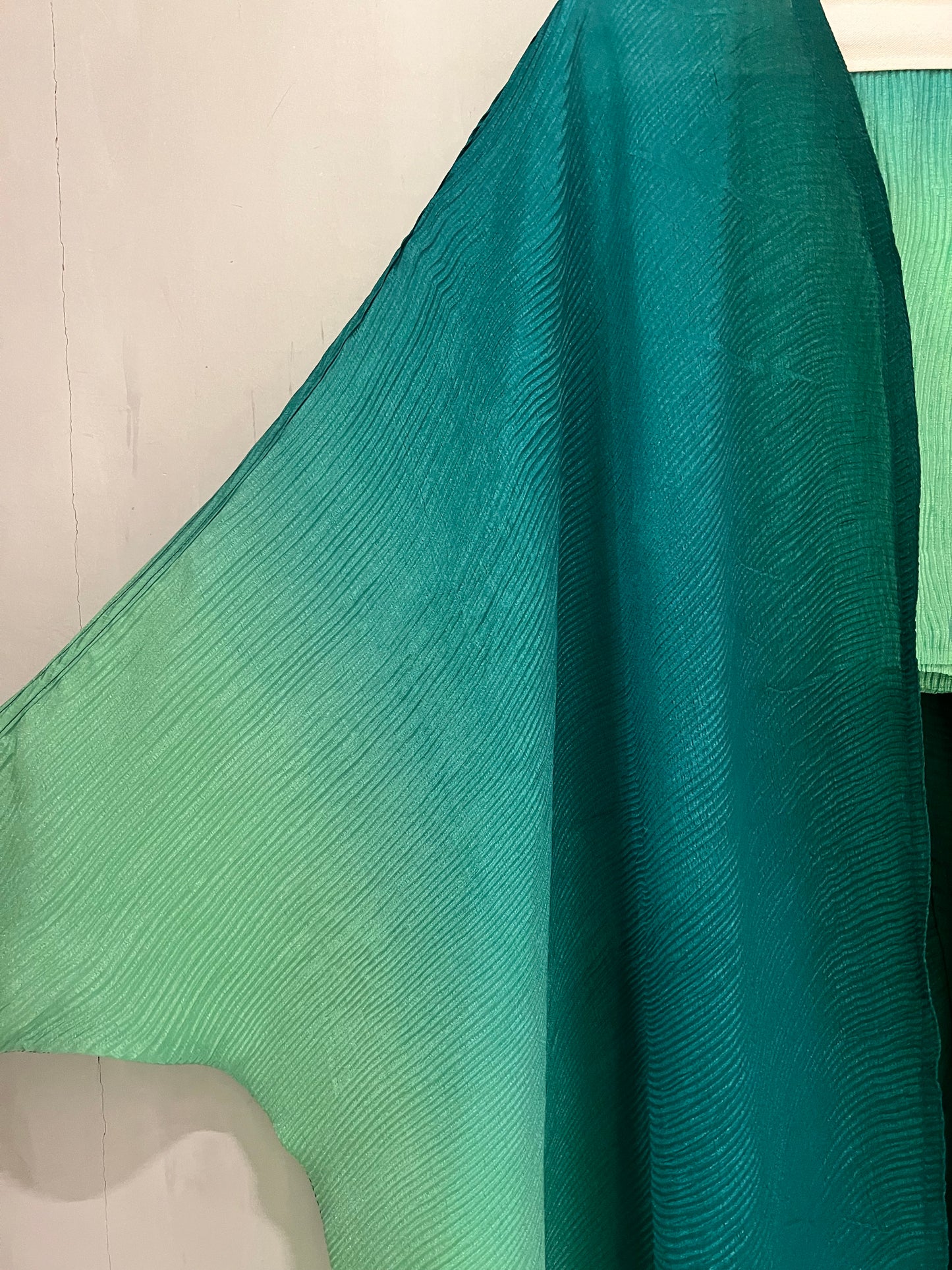 Abaya - ombre design that transitions from deep emerald green to a soft mint shade