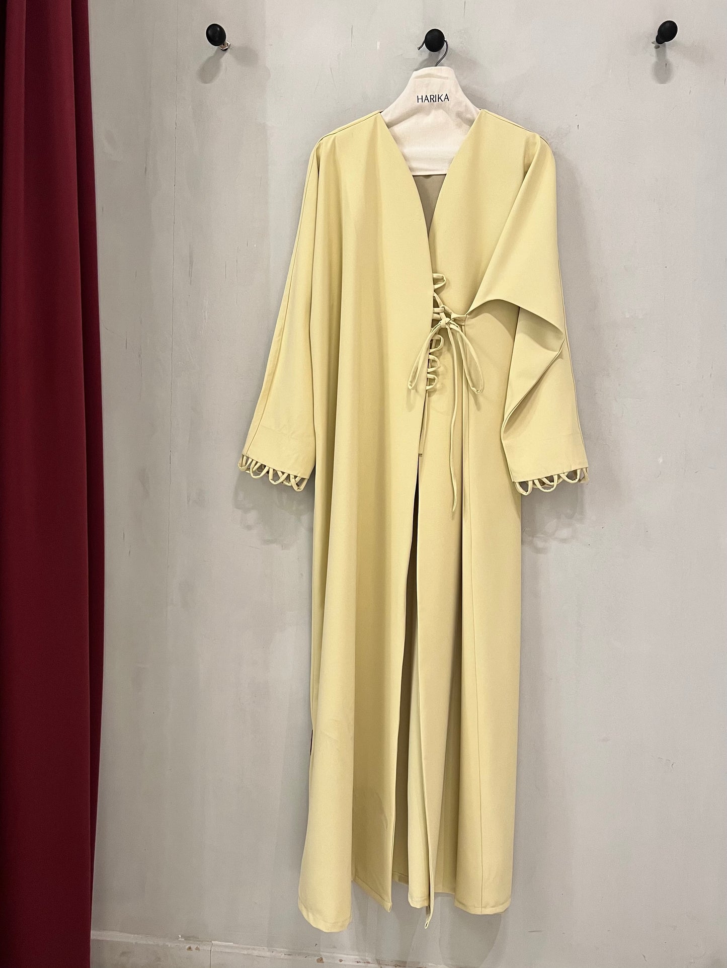 Abaya - Soft butter yellow, wide sleeves are finished with looped trim accents