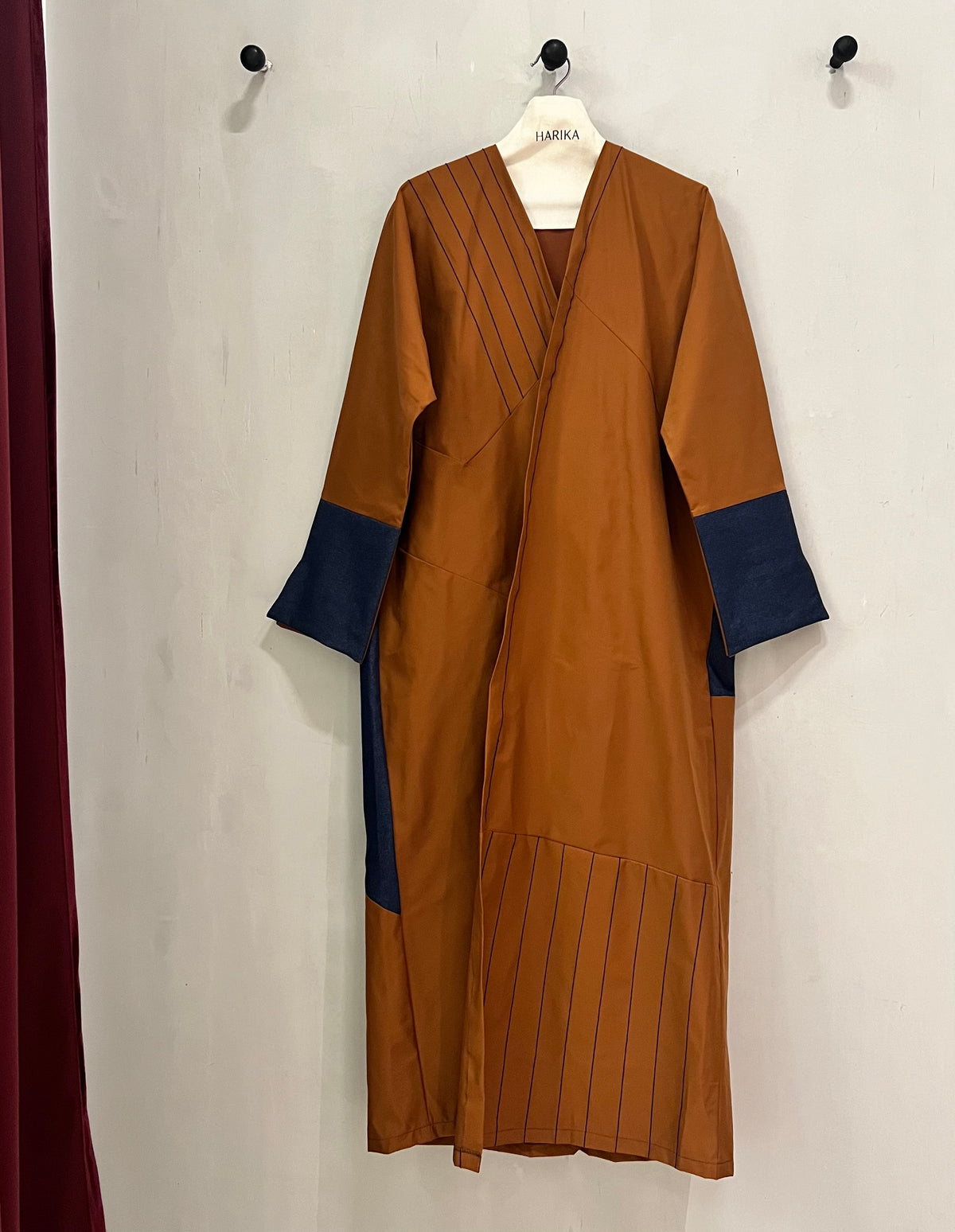 Abaya- a rich rust-brown shade beautifully contrasted with deep navy-blue accents