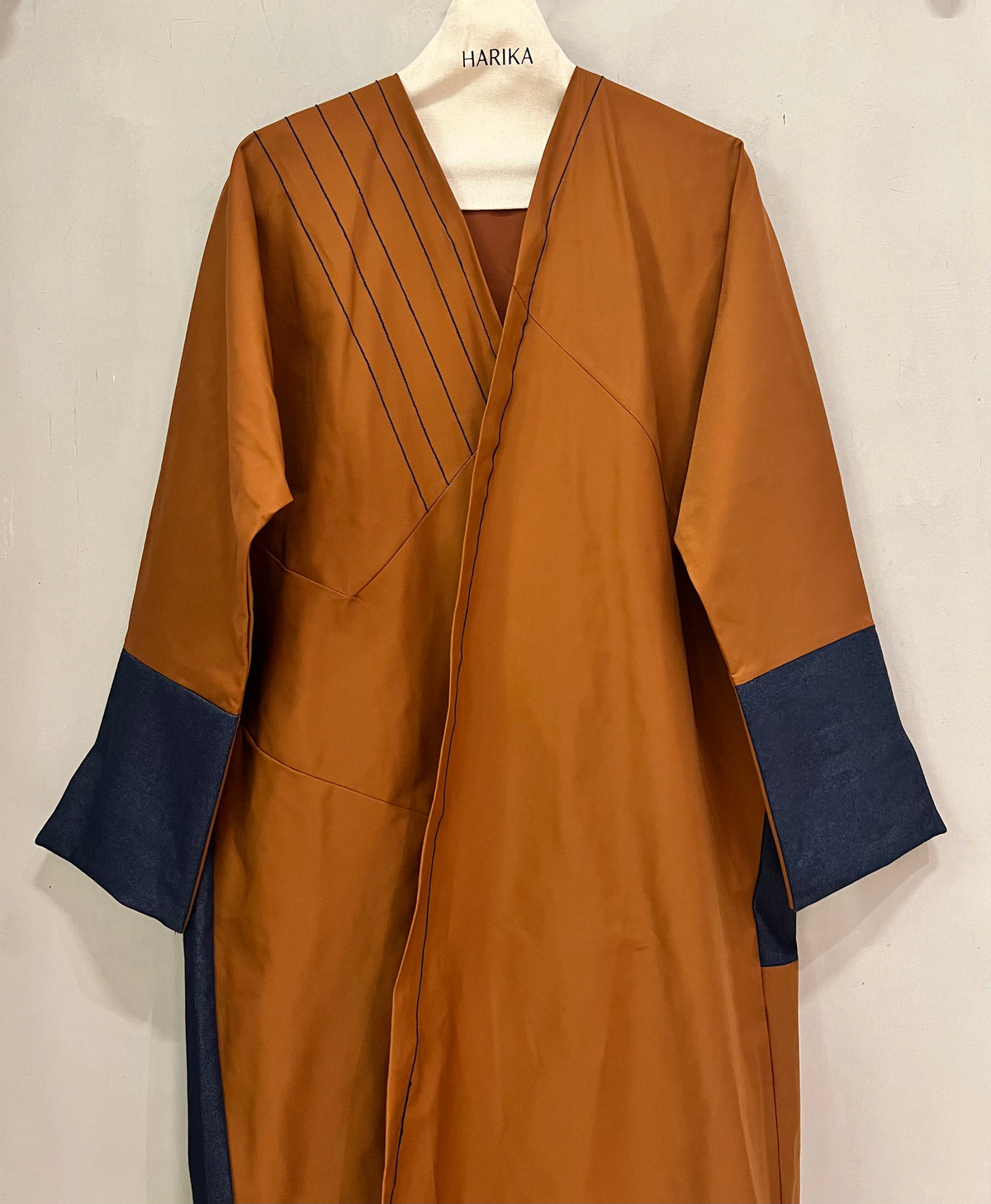 Abaya- a rich rust-brown shade beautifully contrasted with deep navy-blue accents