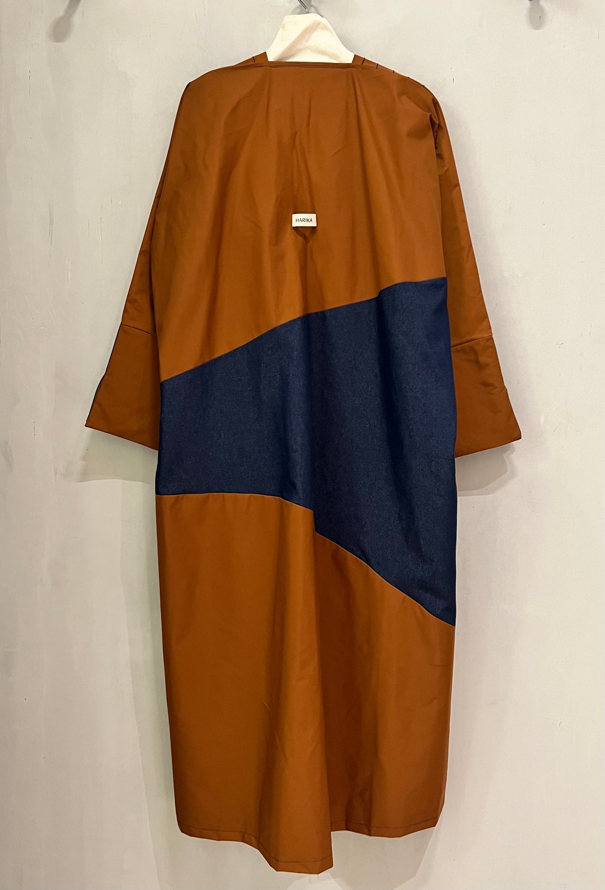 Abaya- a rich rust-brown shade beautifully contrasted with deep navy-blue accents