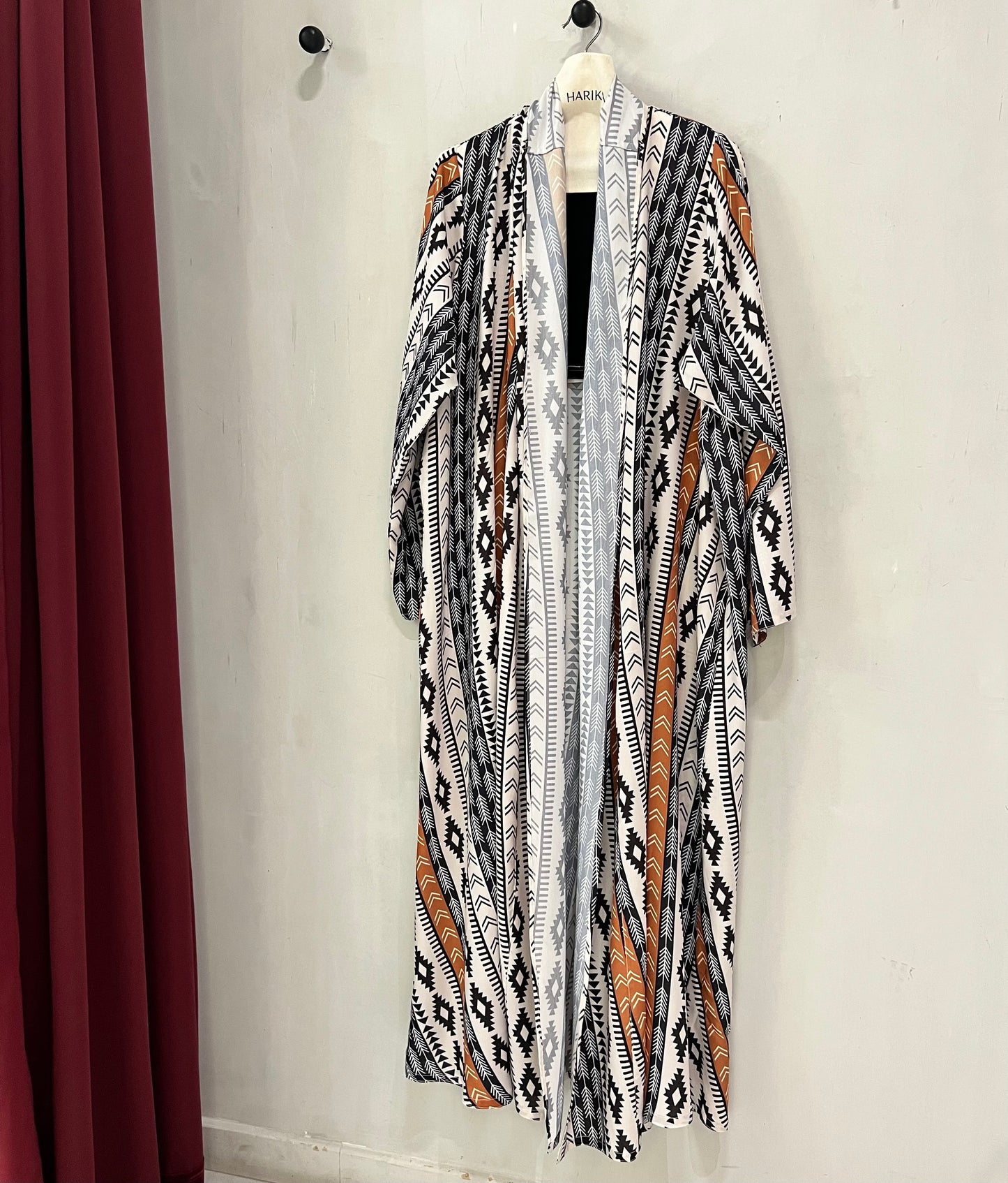 Abaya - Black and ivory base with rust accent stripes