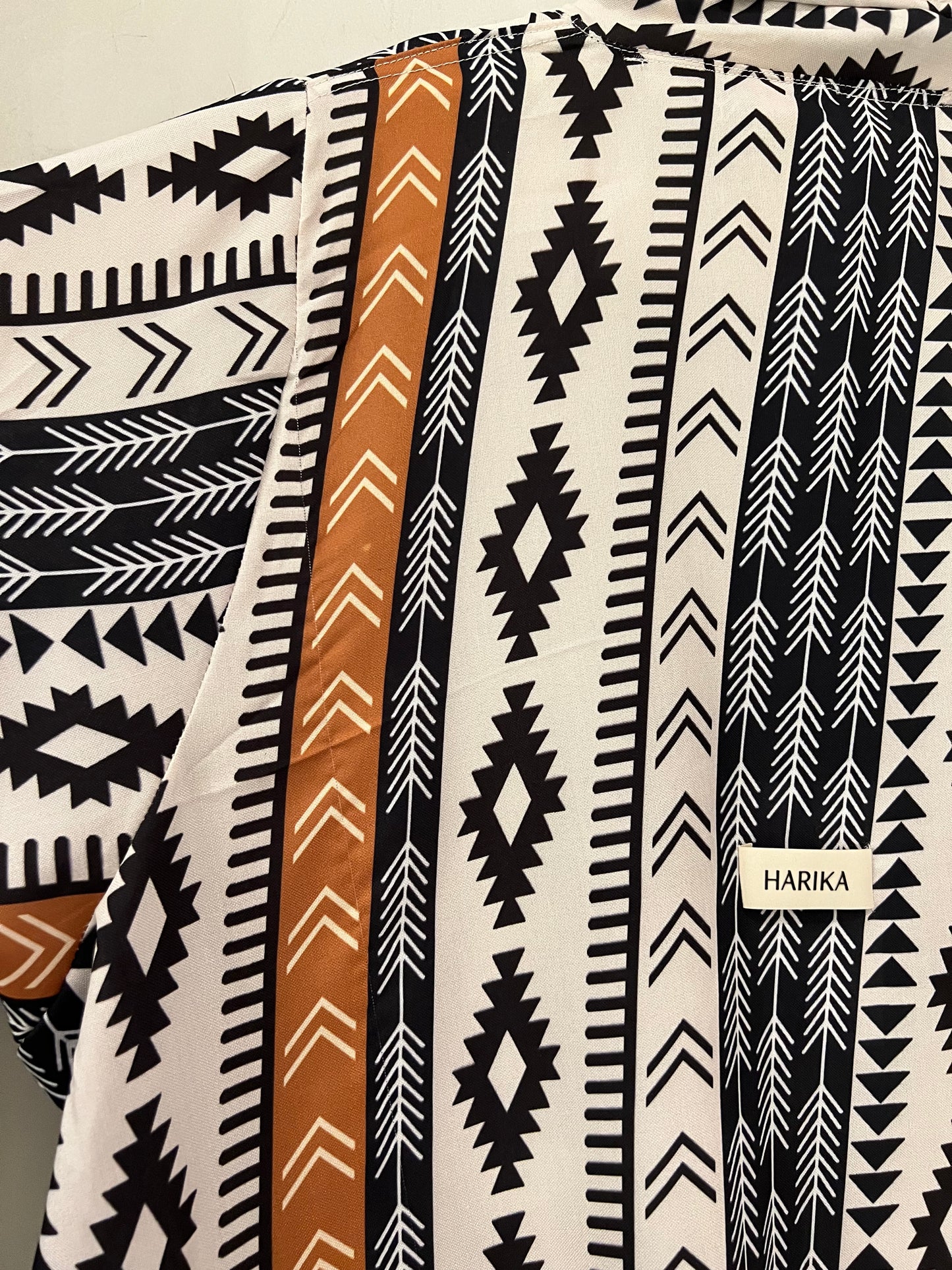 Abaya - Black and ivory base with rust accent stripes