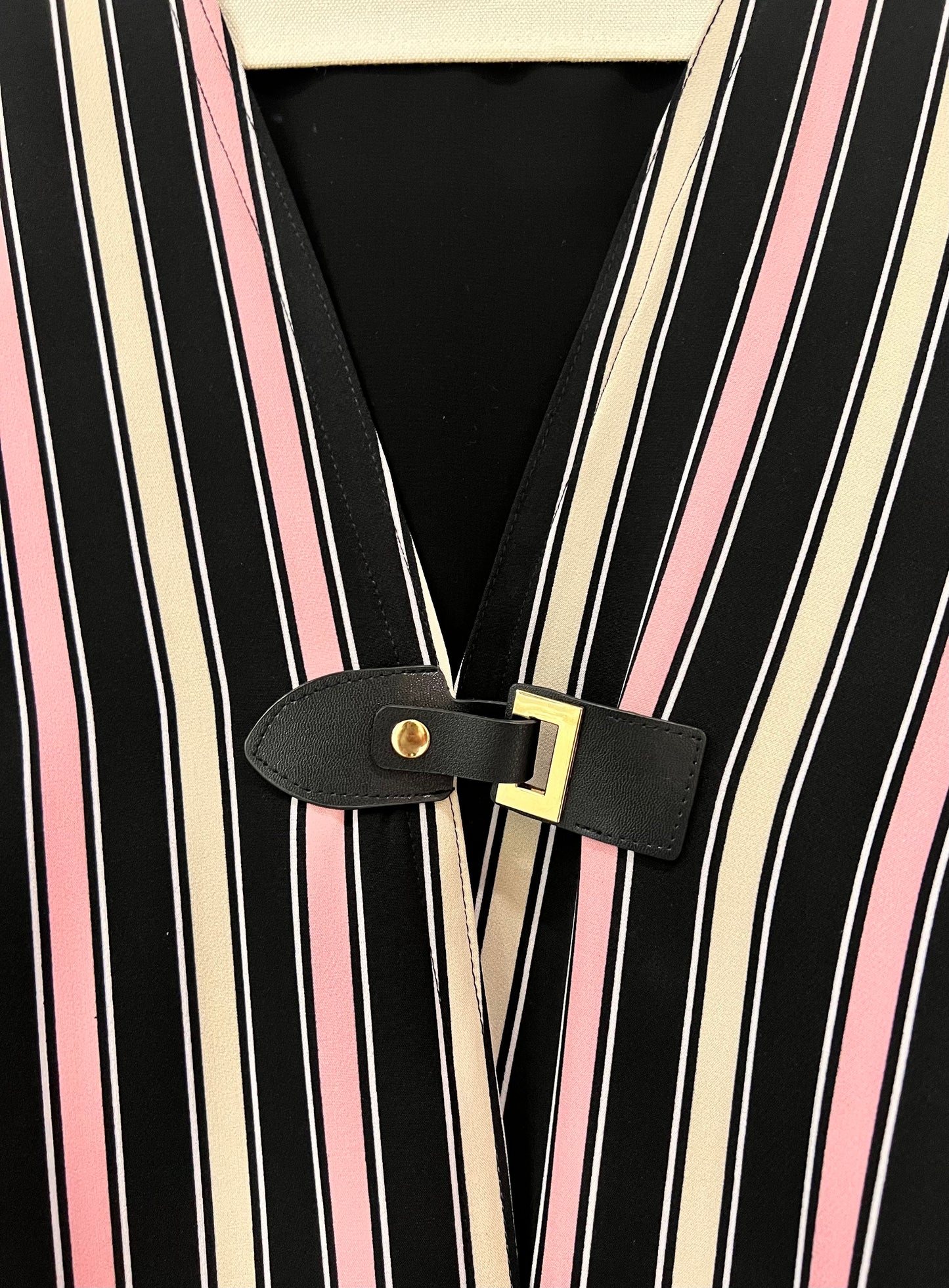 Abaya - Elegant black, pink, and cream stripe pattern with stylish front buckle closure
