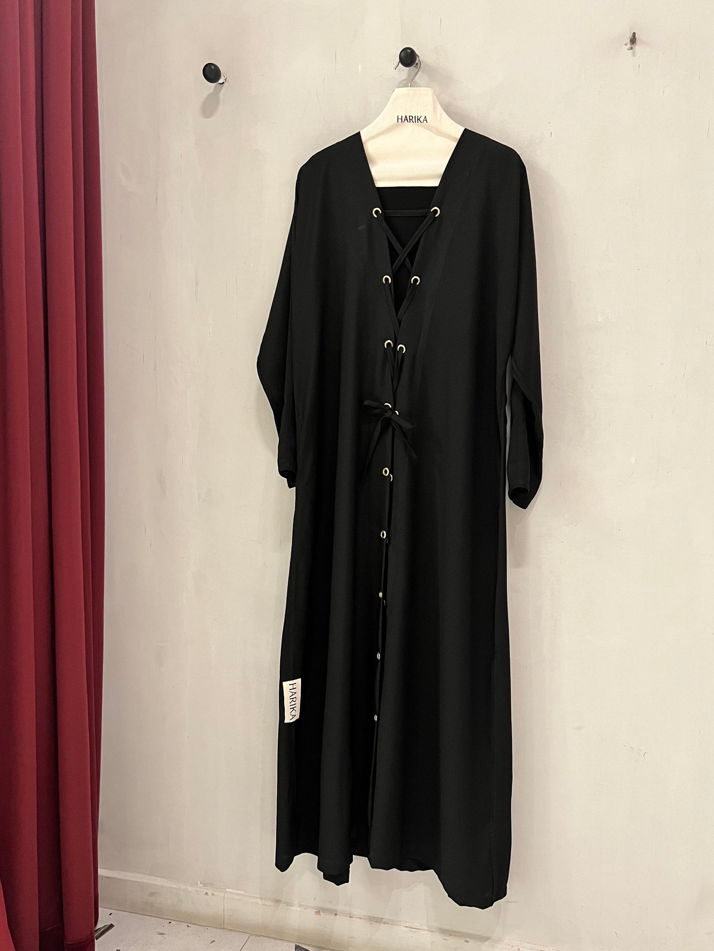 Abaya - Lace-up front detail with gold eyelets