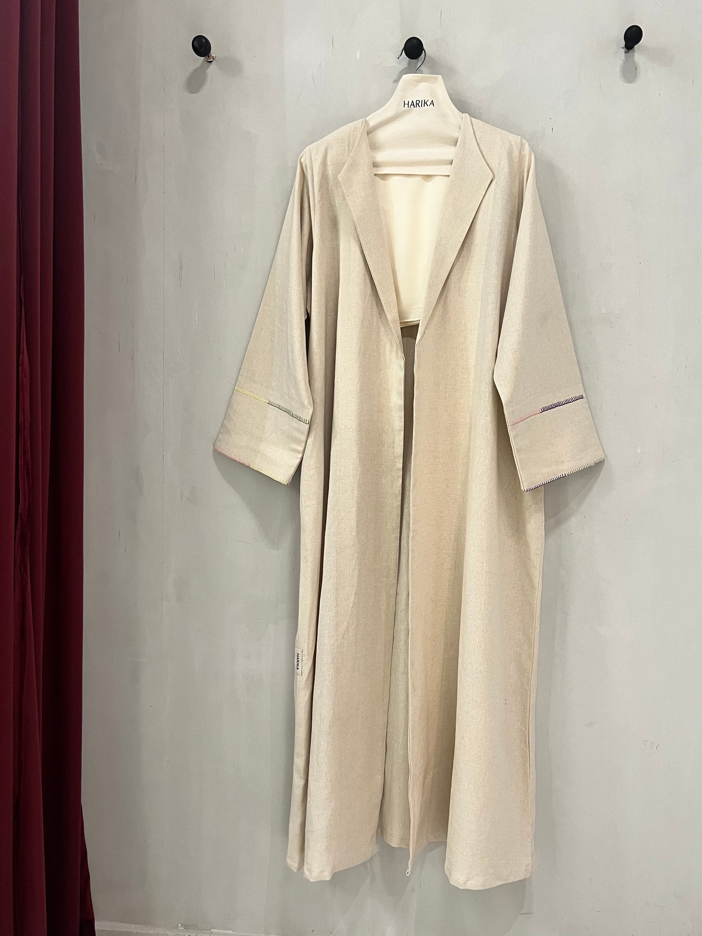 Abaya - Soft oatmeal beige tone, designed with a modern tailored lapel collar and wide relaxed sleeves