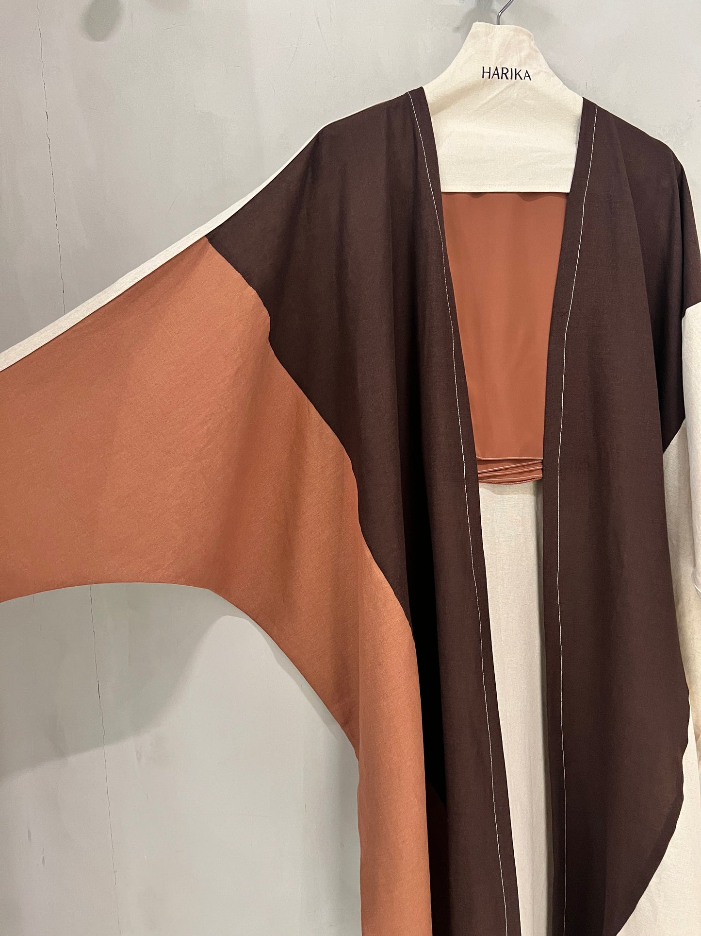 Abaya - Color-blocked abaya featuring a rich chocolate brown, soft cream, and warm terracotta palette