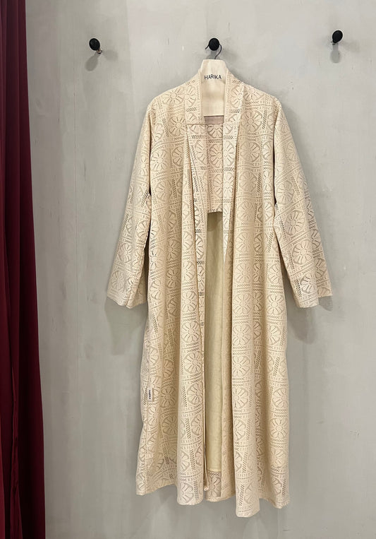Abaya - a soft cream-beige color with an elegant floral lace overlay