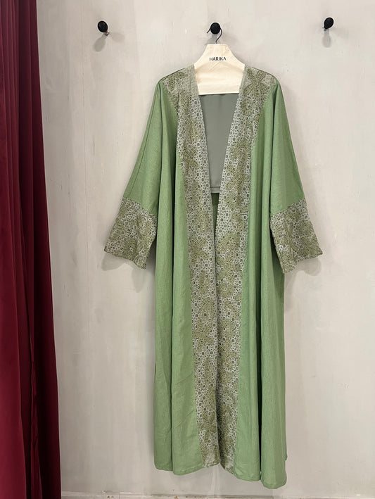 Abaya - Sage green exudes sophistication with its soft, earthy tone and refined lace detailing