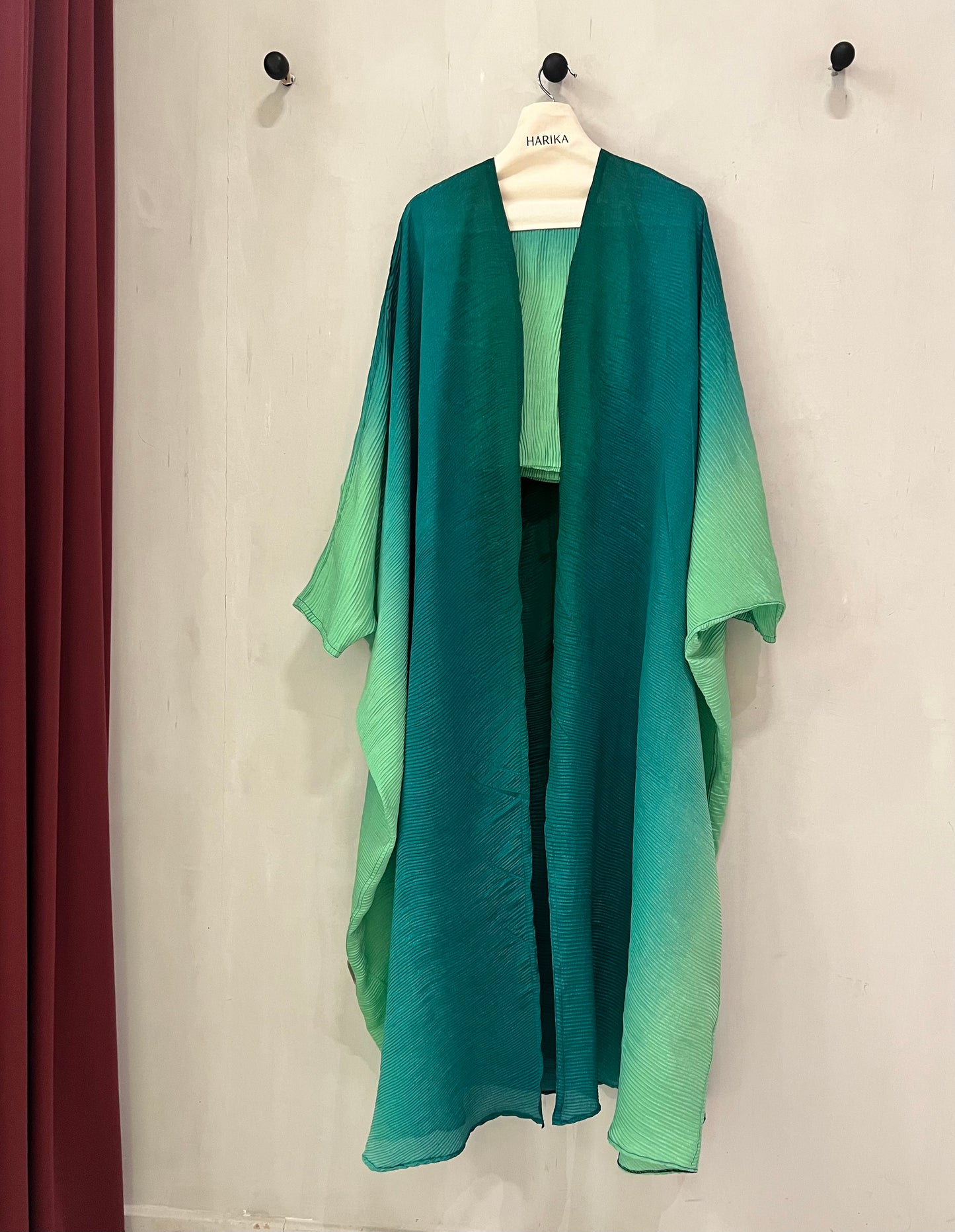 Abaya - ombre design that transitions from deep emerald green to a soft mint shade