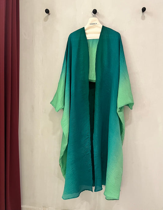 Abaya - ombre design that transitions from deep emerald green to a soft mint shade