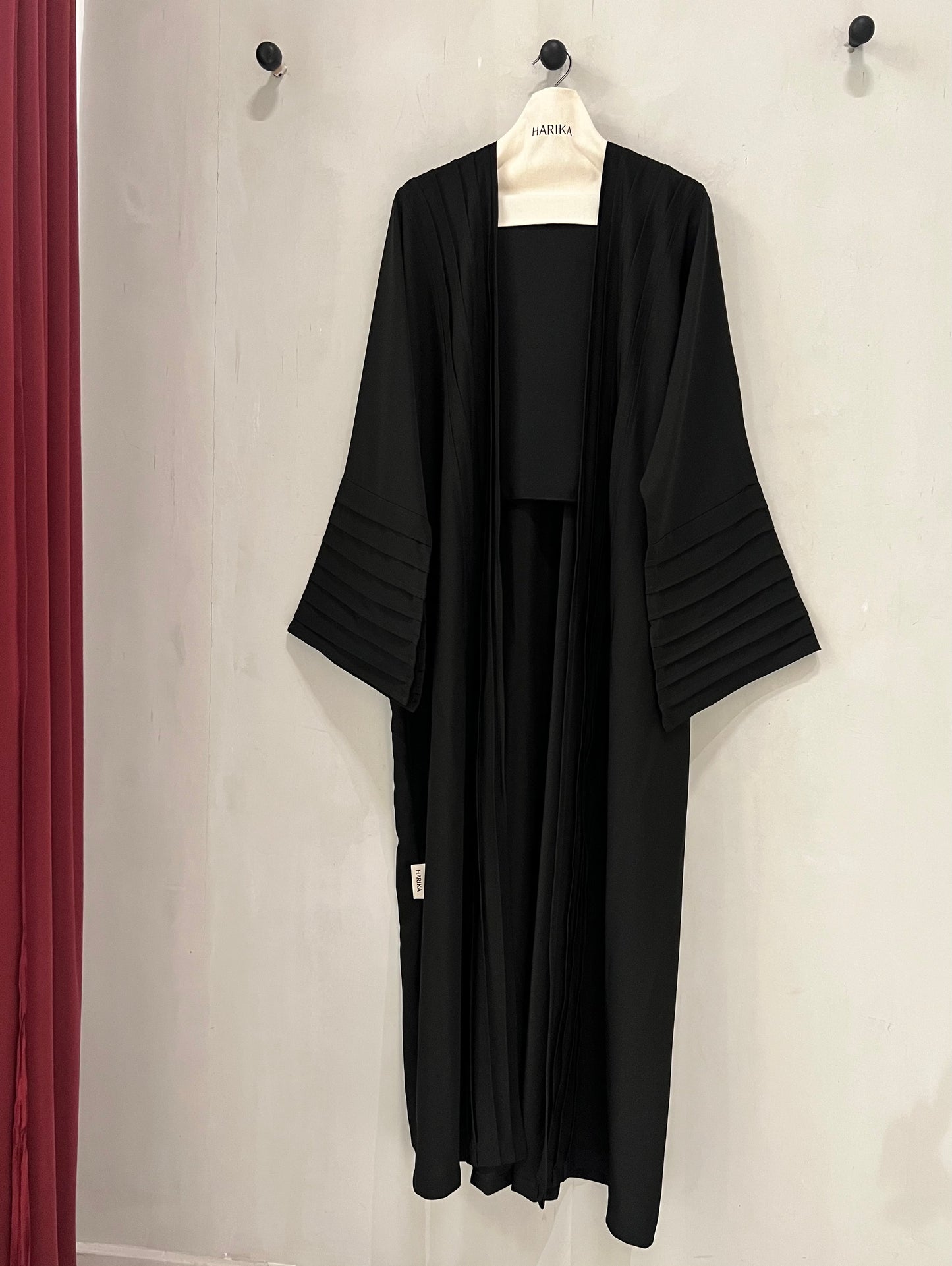 Abaya- Crafted with elegant pleated sleeves and a graceful silhouette that never goes out of style