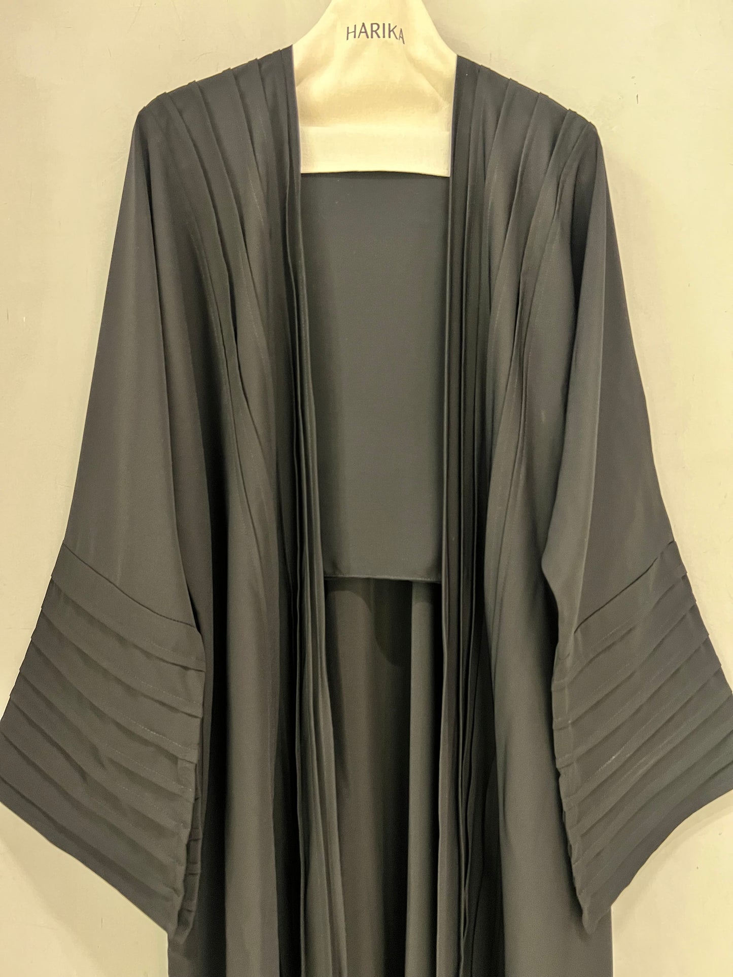 Abaya- Crafted with elegant pleated sleeves and a graceful silhouette that never goes out of style