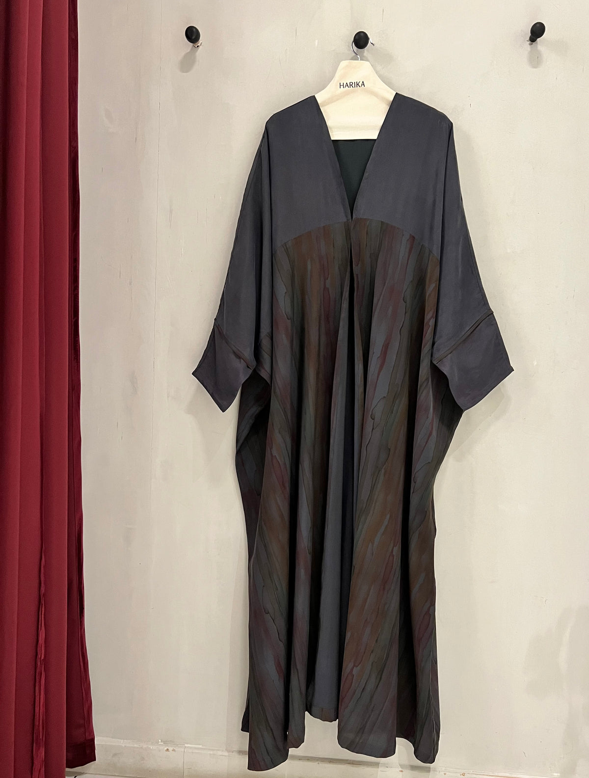 Abaya- a gorgeous dark gray, features flowing marble-inspired panels