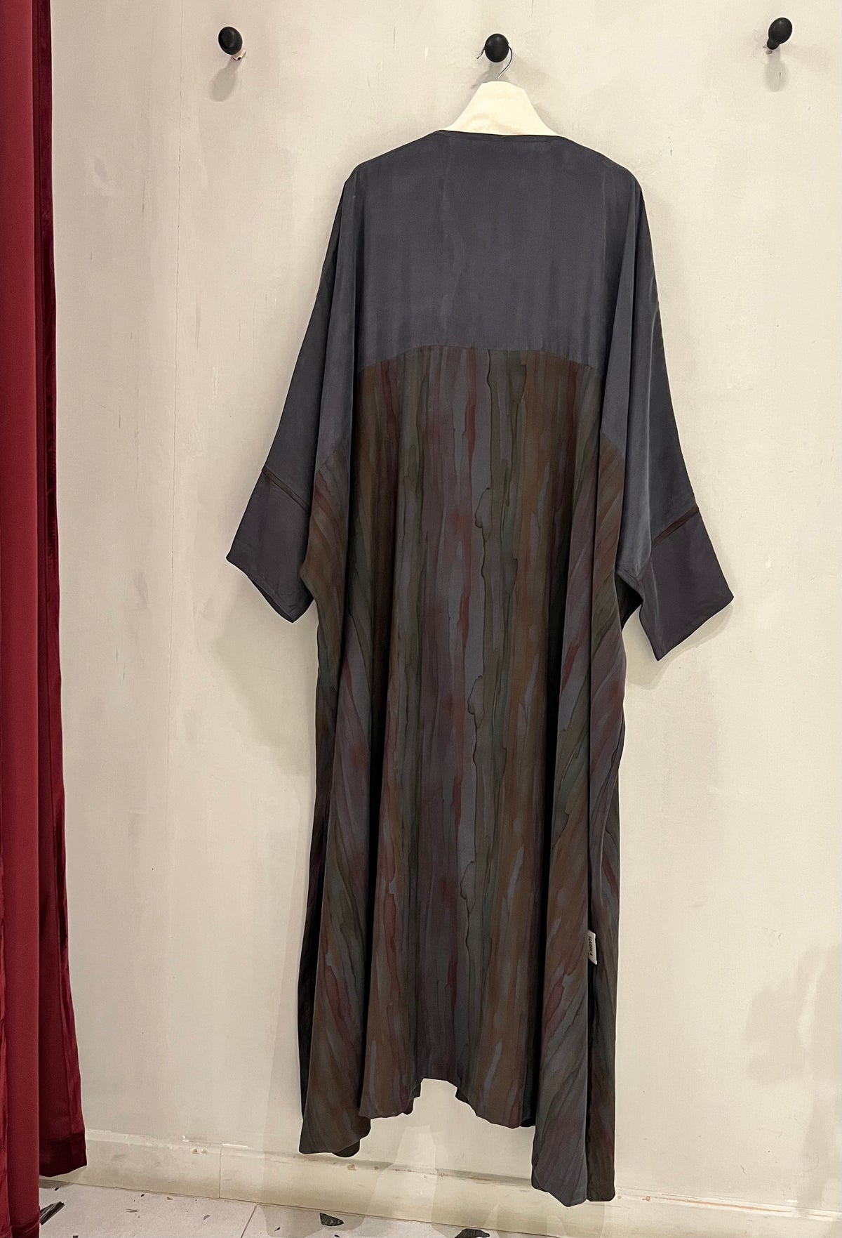 Abaya- a gorgeous dark gray, features flowing marble-inspired panels