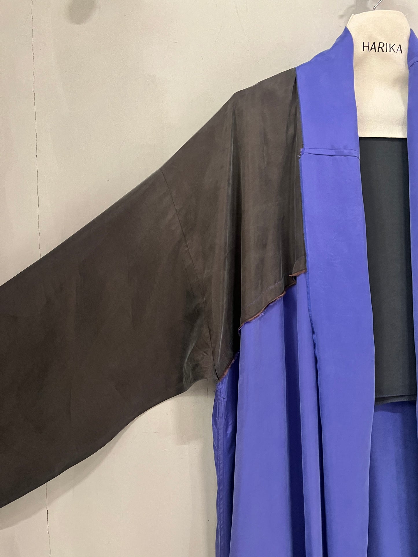 Abaya- a flowing amethyst purple accented with sleek black sleeves and shoulder panels