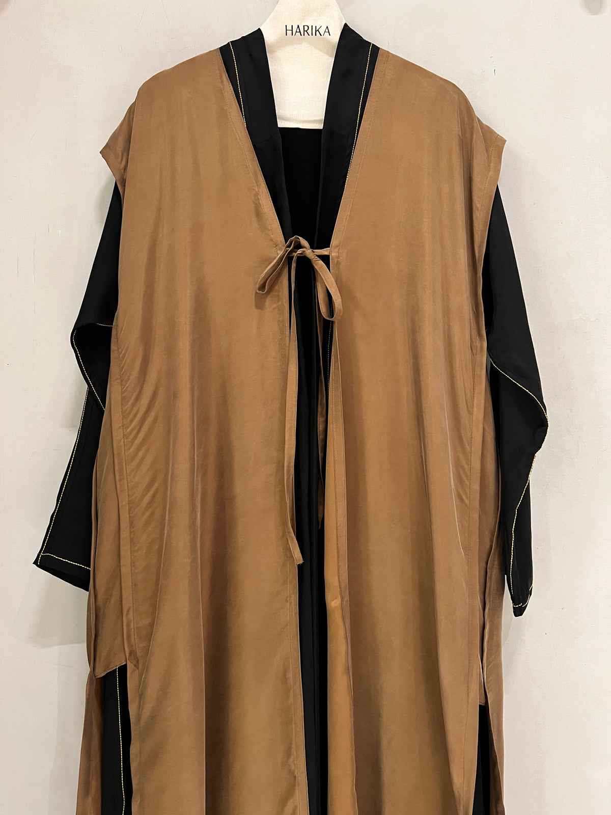 Abaya- a striking caramel brown and black abaya featuring a flowing open-front outer layer
