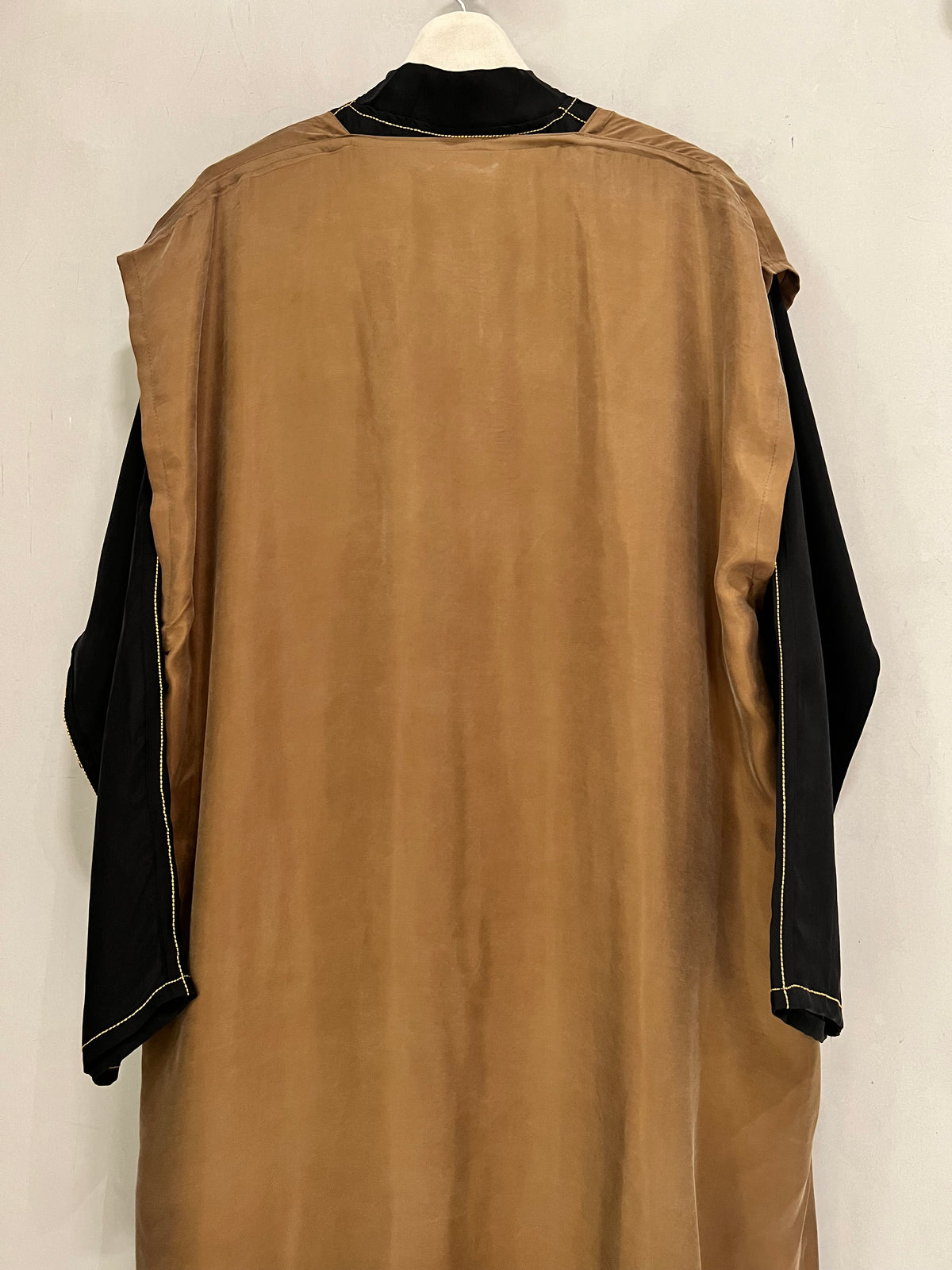 Abaya- a striking caramel brown and black abaya featuring a flowing open-front outer layer
