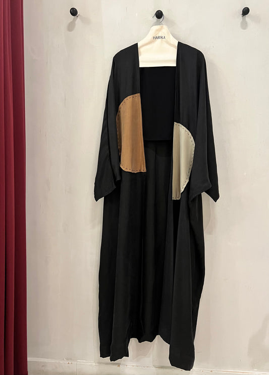 Abaya- Modern black with contrasting tan and ivory curved panel details, finished with visible decorative stitching