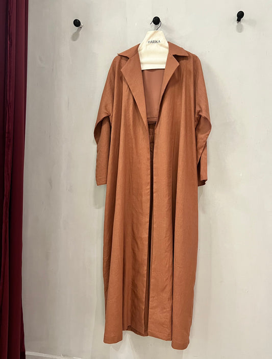 Abaya- A caramel-toned abaya designed in a modern trench-coat silhouette with an elastic waist detail