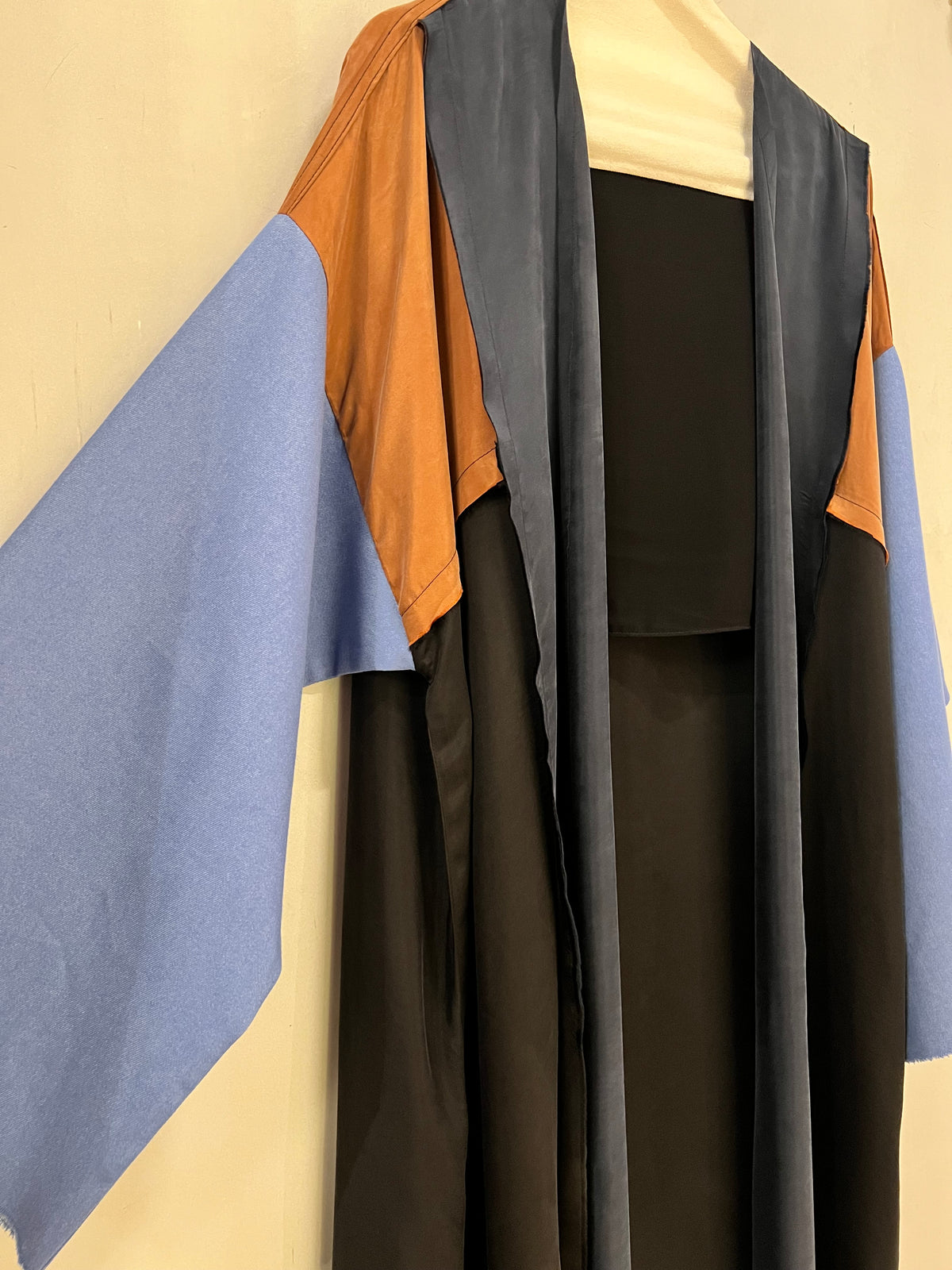 Abaya- A beautiful black and deep navy abaya accented with warm caramel brown and soft blue jeans sleeves