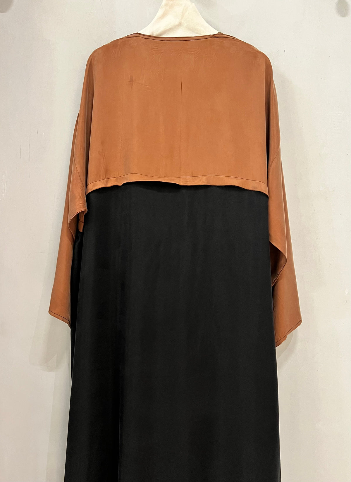 Abaya- A refined caramel and black abaya featuring a sleek layered design